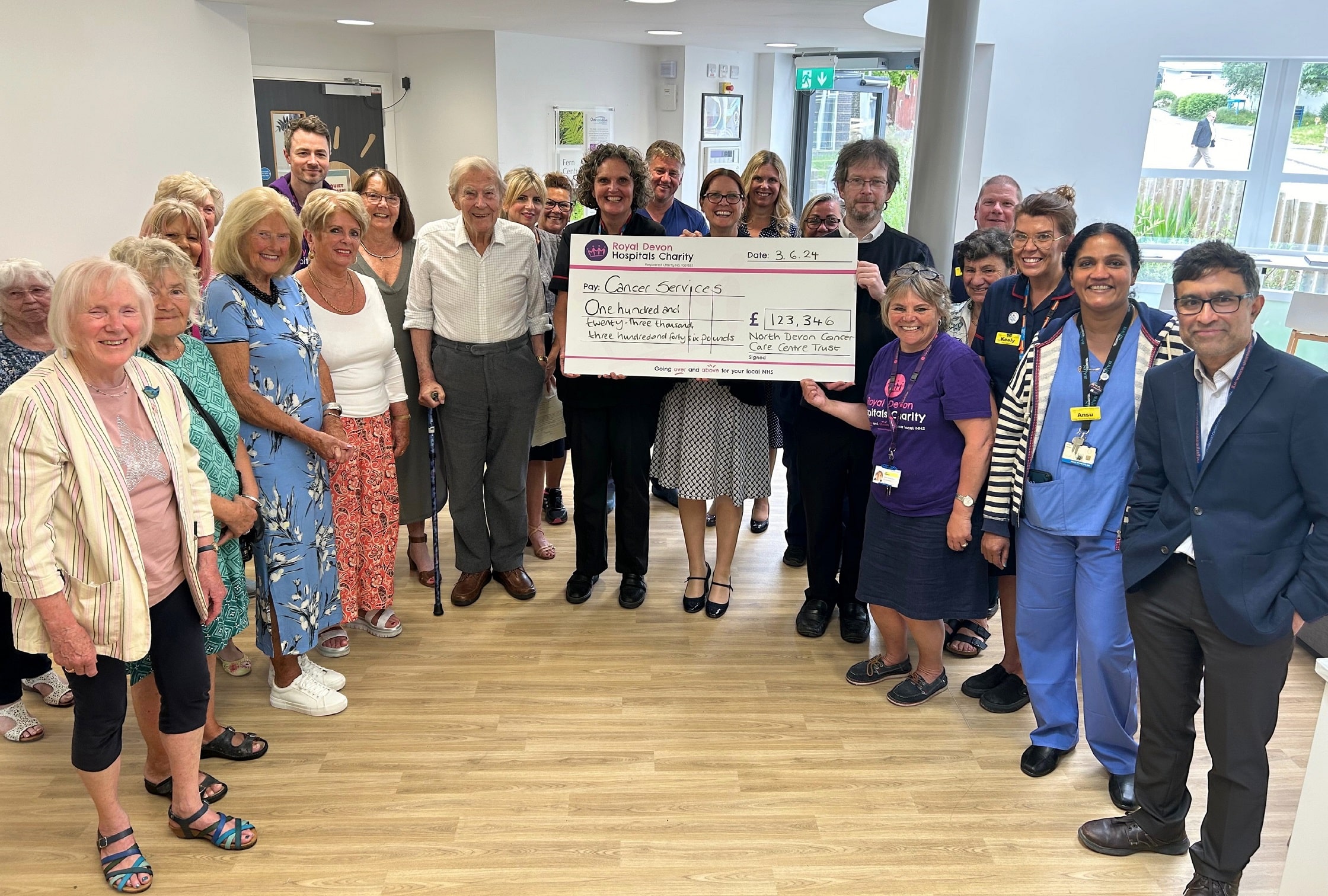 NDCCCT chairman James Bonetta and volunteers present the charity’s final fundraising cheque to Carolyn Mills, Chief Nursing Officer at Royal Devon University Healthcare NHS Foundation Trust.